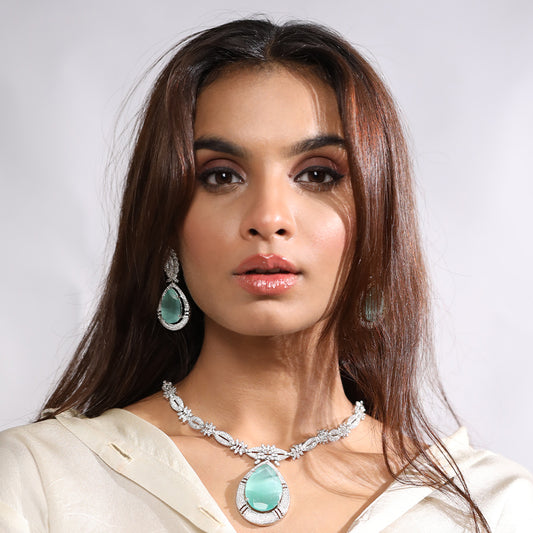 A woman wearing Imperial Elegance American Diamond Necklace Set with Earrings (Green).