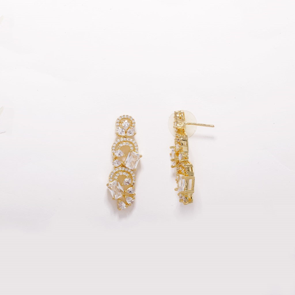 An image showing Infinite Swirl Radiance American Diamond Earrings (Gold).