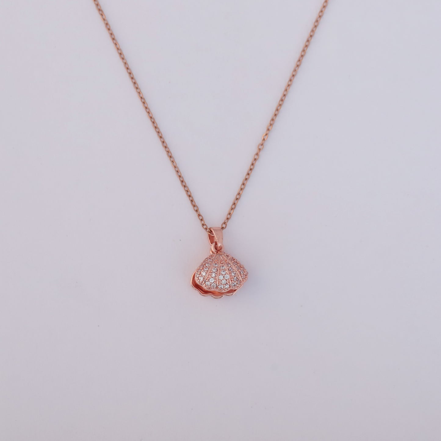 Sparkling Rose Gold Seashell Pendant with Pearl